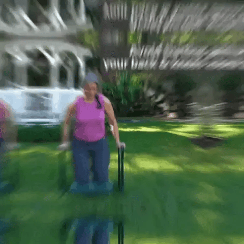 Woman folding a garden kneeler bench outdoors to avoid back and knee strain
