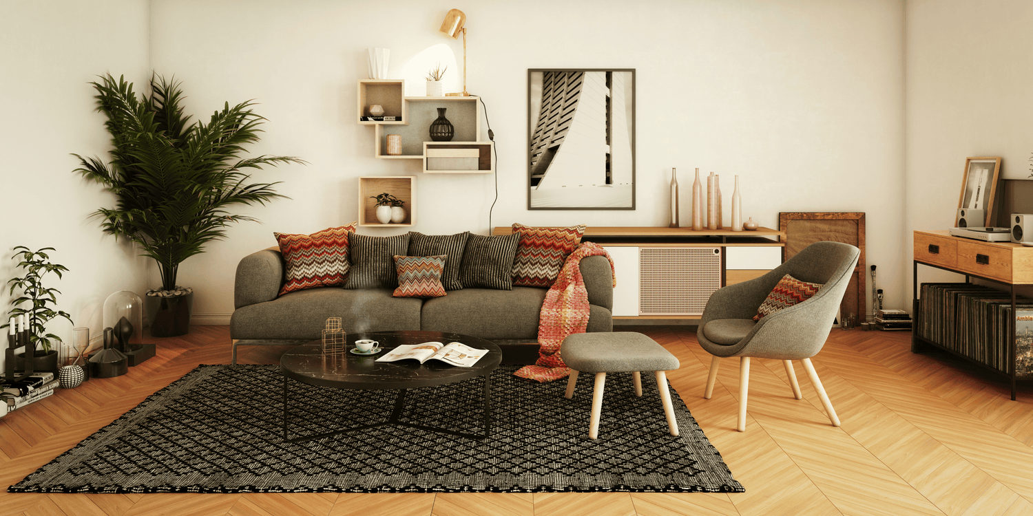 Cozy mid-century modern living room with a grey sofa, patterned pillows, indoor plant, and minimal wooden decor elements